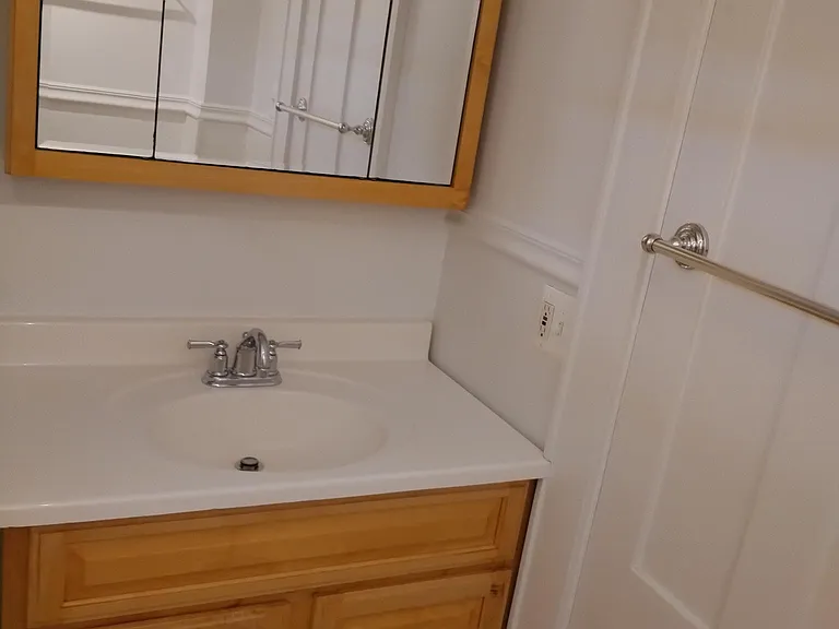 bathroom vanity and triple mirror medicine cabinet