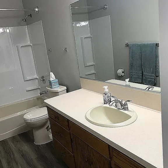 Downstairs full bath with large vanity area.