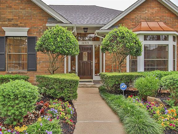 Coming up the front walk, you'll notice the lush landscaping and pristine curb appeal!