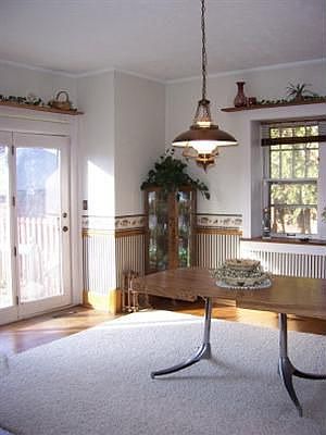 Big dining room with atrium doors to deck and private backyard