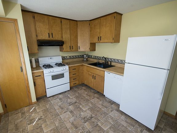 The kitchen (10x14) features a large window, a view to the living room, ample cupboard space as well as a pantry with shelving for additional storage. Newer appliances, updated sink and facet complement the kitchen. The space near the window is a perfect seating area or create additional counter space with a moveable island.