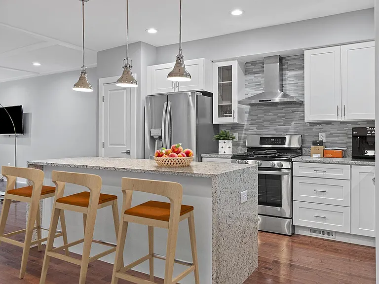 This image shows a virtually furnished space. This space comes unfurnished but can come beautifully furnished by our in-house design team for an additional fee.
