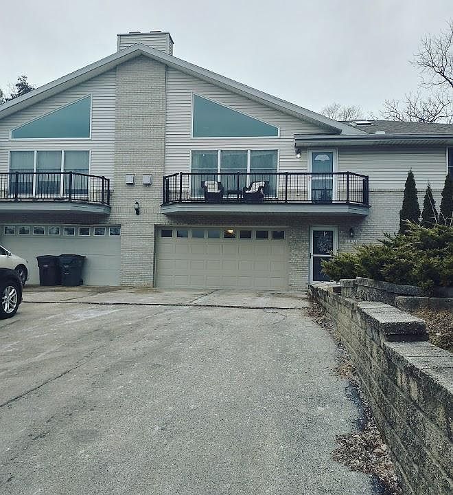 exterior of property with wide double driveway shared by both units