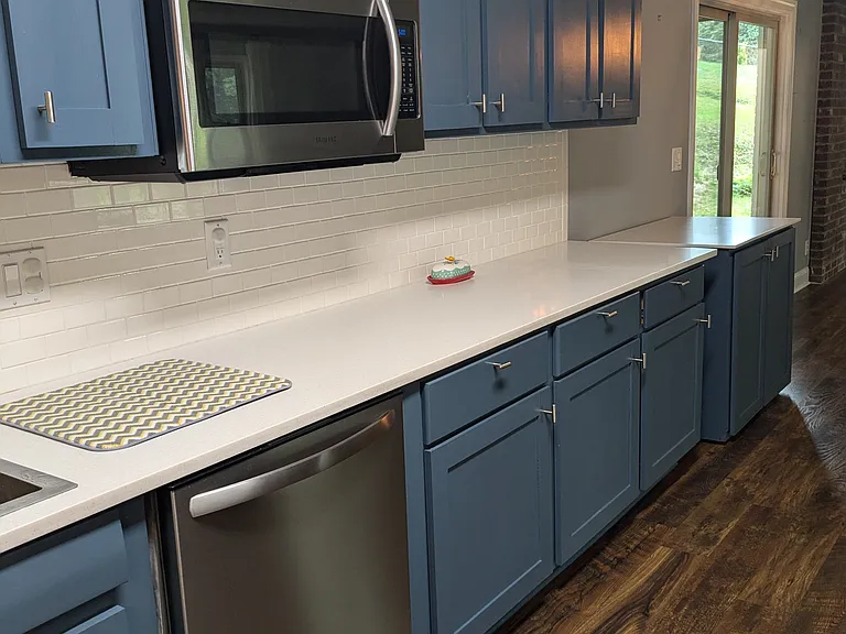 Stainless steel dishwasher and microwave. Plenty of countertop and cabinet storage space