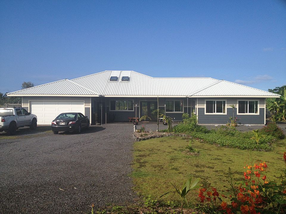 Front of our home, hardy back siding and white roof keeps our home cool.