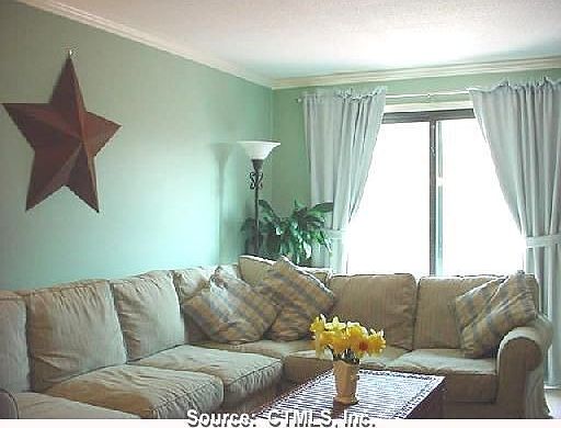 Living room is great for large furniture and has a slider to the deck.