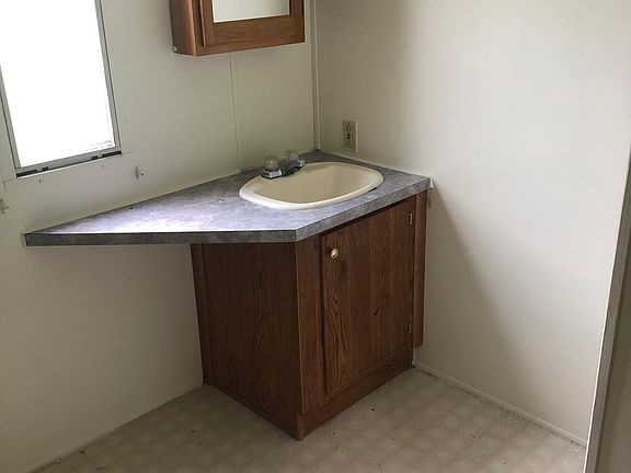 Bathroom vanity is one of the two bathrooms