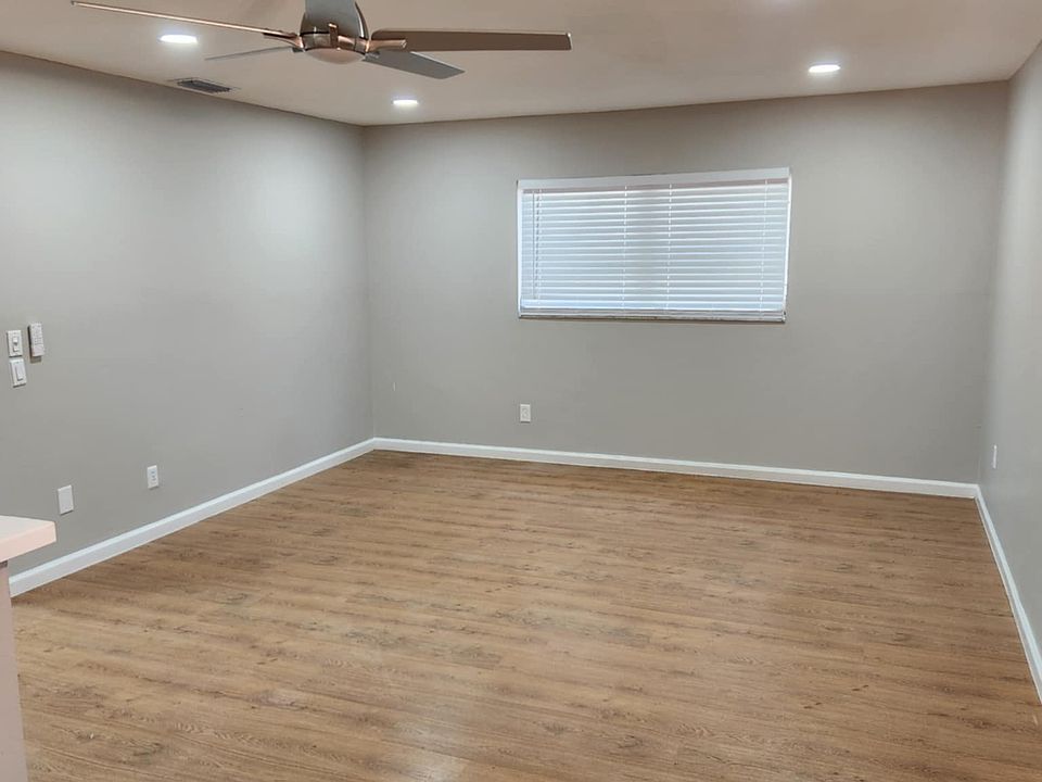 Large living room with new window blinds and recessed led lights and freshly painted throughout.