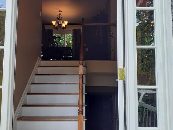 Stairs from front door to main level