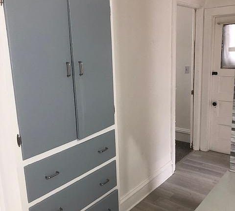 Existing shelving and storage in the upstairs apartment