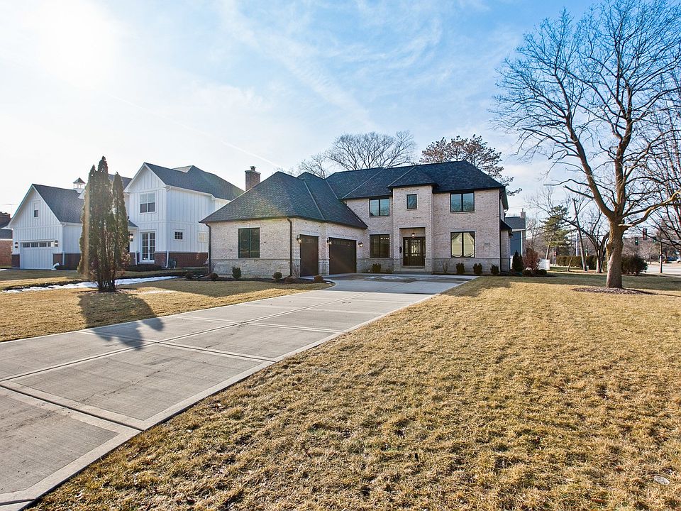 Elegant all brick & stone New Construction with 3 car garage