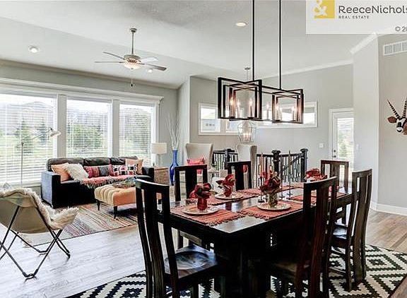 stairs to the back corner lead to the lower level. Door leads to the covered deck or patio.