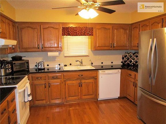 There's hardwood floors, granite counters and stainless steel refrigerator.