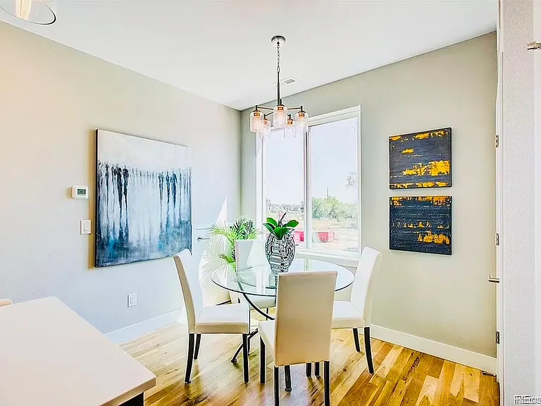 Experience dining in style with this sunlit nook, perfect for intimate meals. Experience dining in style with this sunlit nook, perfect for intimate meals.