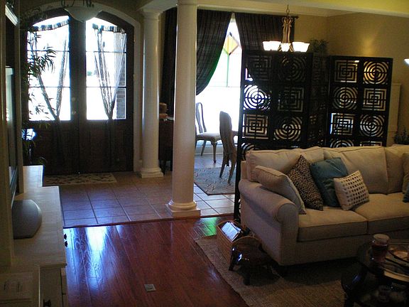 Foyer and Formal Dining Room with Hardwood Floors