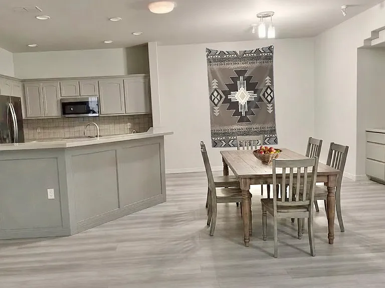 DINING room is staged with a Southwestern Indian Blanket.
