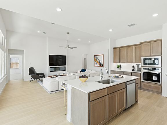 Kitchen in the Gilmour II home plan by Trophy Signature Homes - REPRESENTATIVE PHOTO