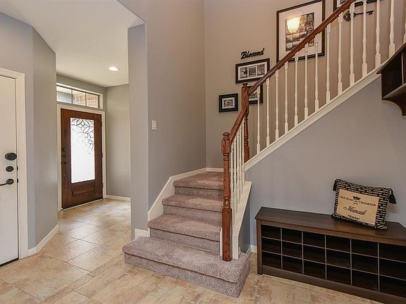 Recent neutral paint and inviting entry way.