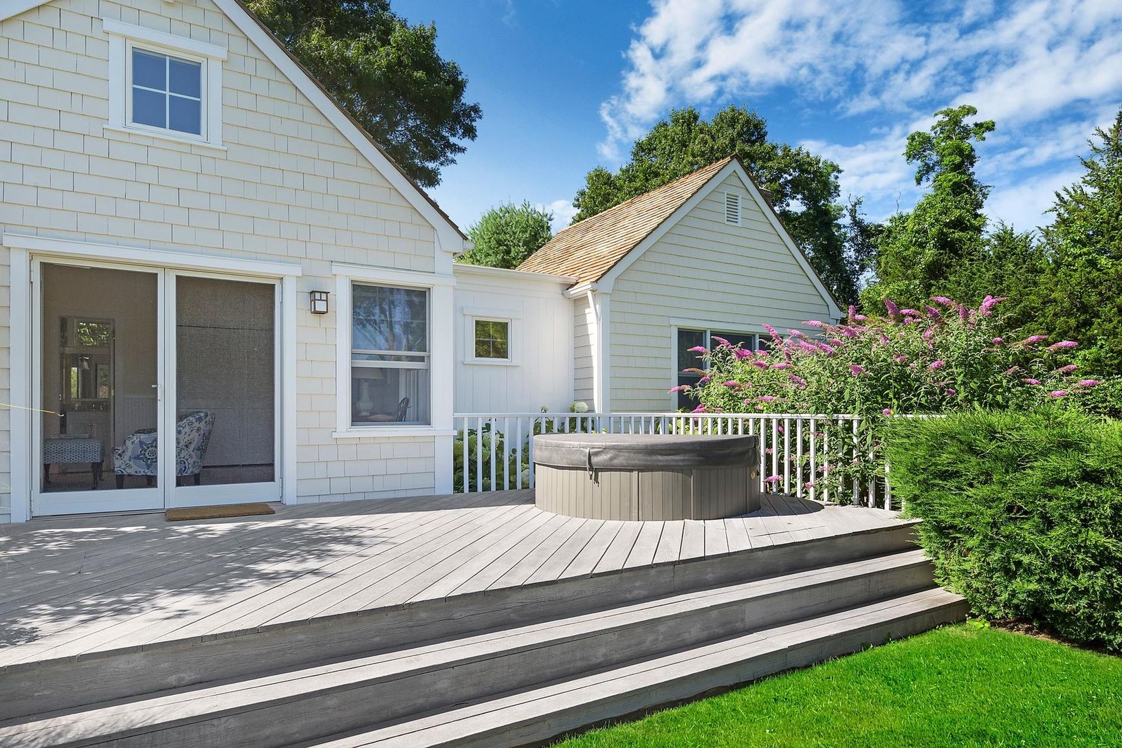 Hot Tub just outside Primary Bedroom Suite, includes hidden stereo speaker. Enjoy garden views