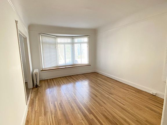 Large main room with lots of light on Broadway side of building....Hardwood floors...Radiator heat...New blinds...