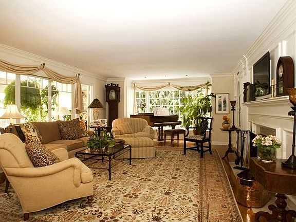 BRIGHT LIVING ROOM WITH HARDWOOD FLR, FIREPLACE AND ARCHITECTURAL DETAILS