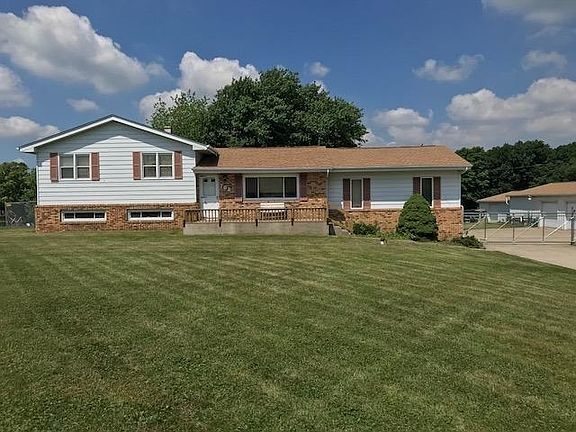 Pole Barn on the right is actually two pole barns built in different years but connected.