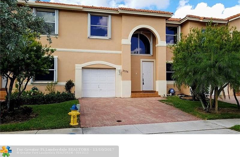 Exterior Front - With double wide driveway