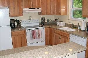 updated kitchen with new countertops and cabinets.