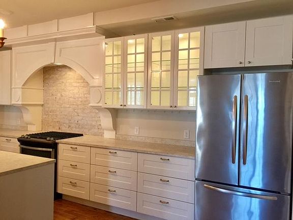 Custom cabinets, stainless appliances