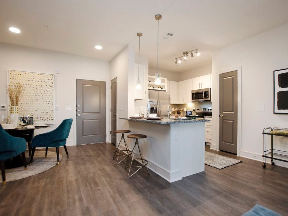 Kitchen and dining area with hard surface flooring