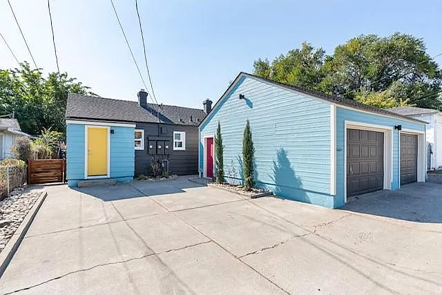Back Door with separate Garage on back of property. (Garage space not included)