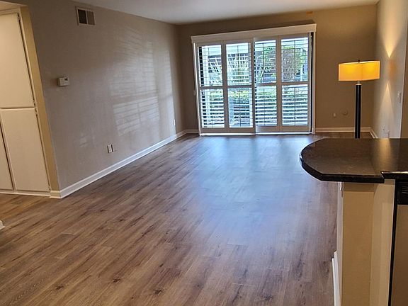 beautiful plantation shutters throughout, notice the luxury flooring and the hallway cabinets