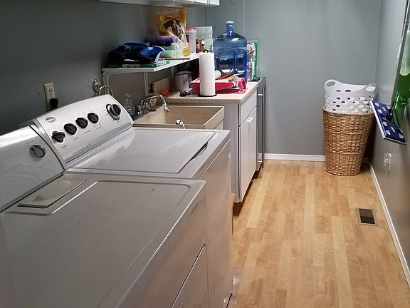 laundry room with storage