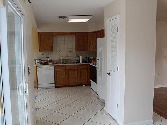 Kitchen and eating area to left