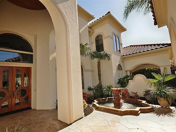 Welcoming courtyard entry with water fountain.