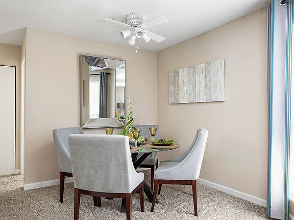 Dining Room with Ceiling Fan - Brookside Apartments