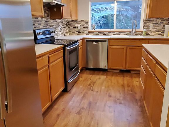 Kitchen with brand new fridge and dishwasher