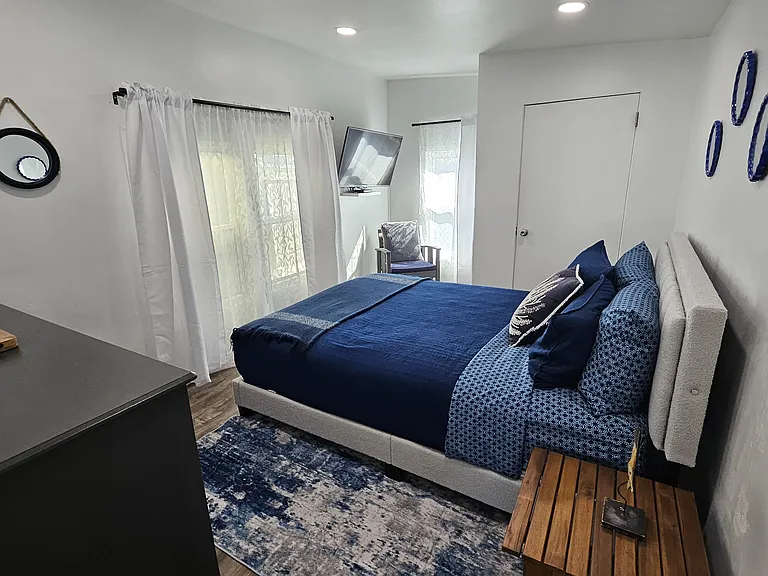 First bedroom with brand new queen mattress and bed