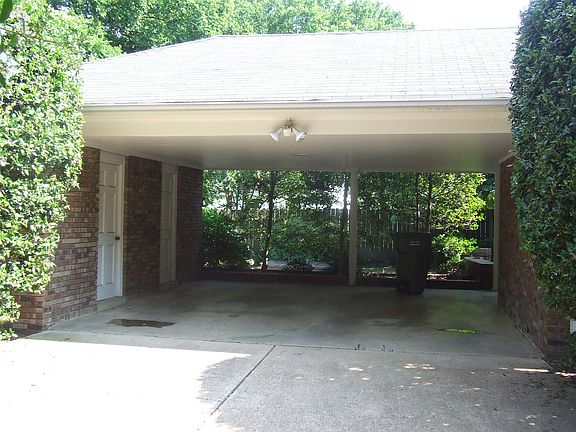 Double Carport in rear with Storage Room.