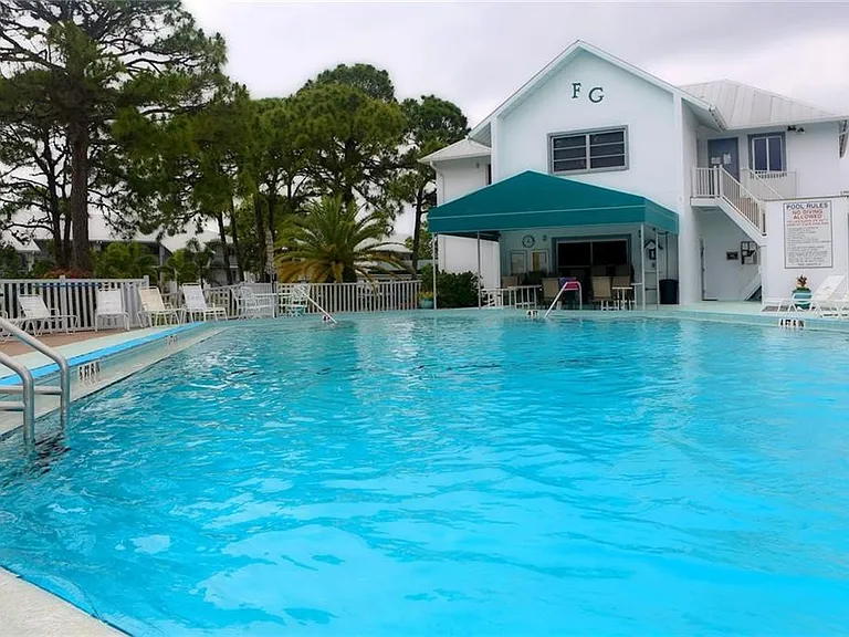 Your tropical oasis awaits. __ Our residents and guests love the large heated pool_it's the heart of the Fiddler's Green community. Grab a towel and come join us!