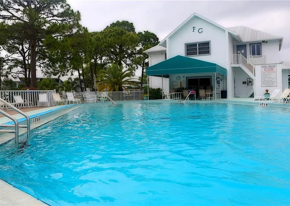Your tropical oasis awaits. __ Our residents and guests love the large heated pool_it's the heart of the Fiddler's Green community. Grab a towel and come join us!
