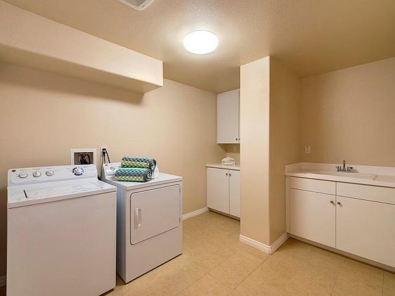 Laundry Room with Utility Sink and Cabinetry