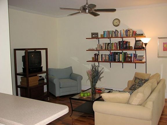 Kitchen looks past the breakfast bar into the open living room. 
