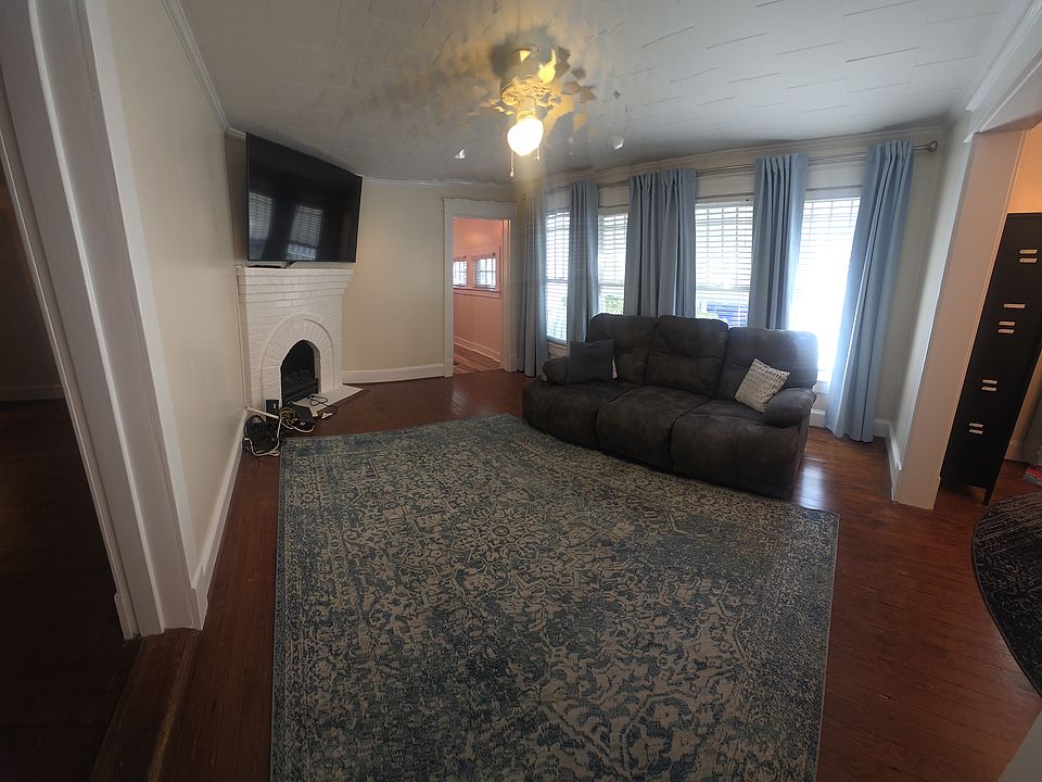 Living room, couch has 3 recliners, optional to renter.