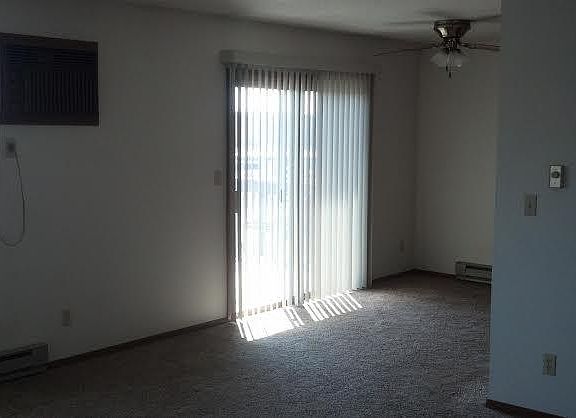 Dining room open with living room and patio doors