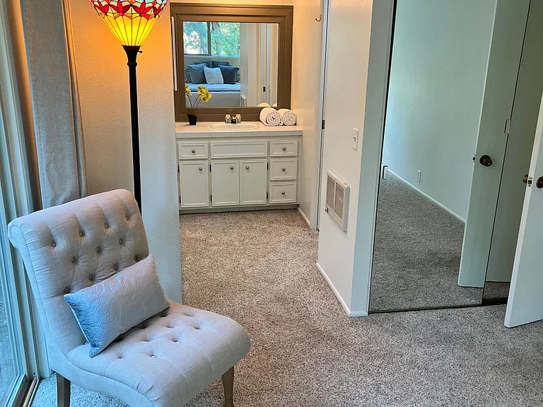 Continental bathroom has the sink and medicine cabinet outside the shower and toilet room. Dressing area has two large closets with mirrors.
