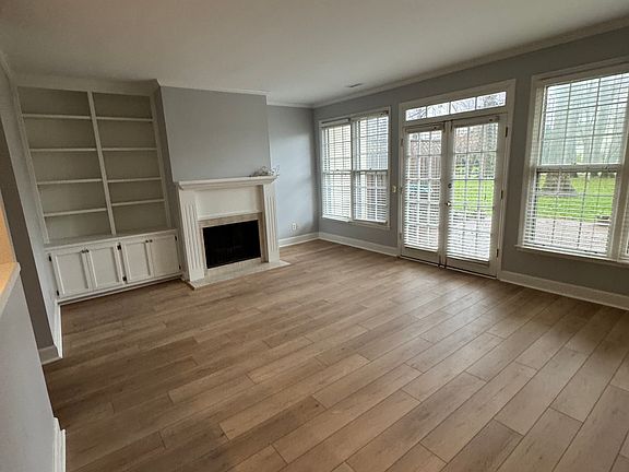 Large light filled living room opens to kitchen and back patio
New wood floors!