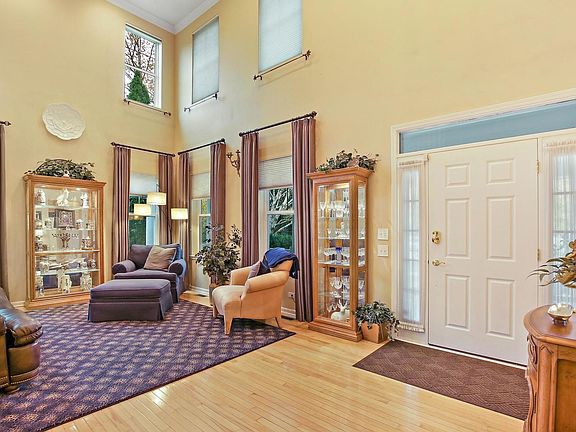 Lovely 2 story living room and hardwood floors