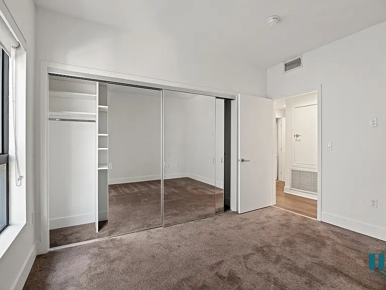 Bedroom with Large-Size Closet with Built-In Shelving