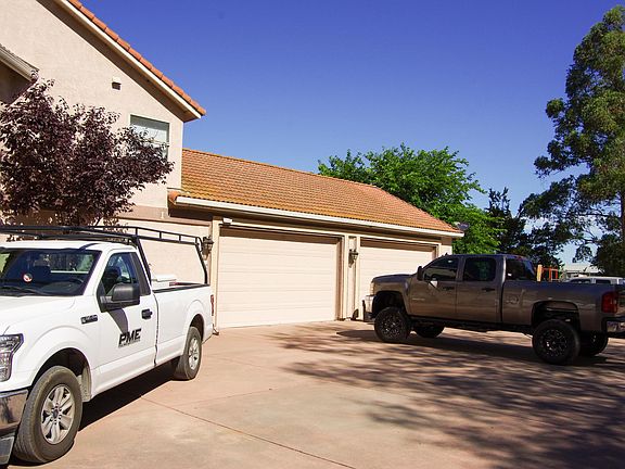 Huge driveway apron for tons of parking and oversized 4-car garage with 9ft high garage door openings for truck clearance